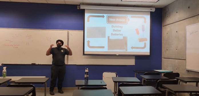 talkingaboutbatteries Adult African-American man wearing a black mask talks about presentation titled "Building Better Batteries".