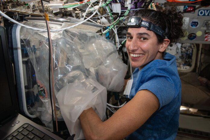 3d-bioprinting NASA astronaut Jasmin Moghbeli swaps components inside the BioFabrication Facility (BFF)